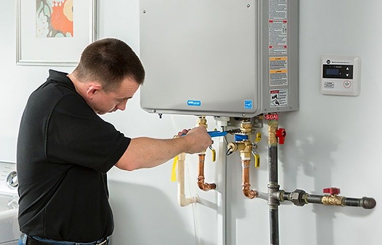 Installing a tankless water heater with Get Del Mar.